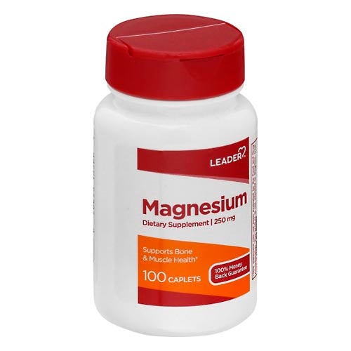 Bottle of Leader Magnesium 250 mg caplets, dietary supplement, with 100 capsules in a white bottle.