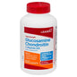 Leader™ Triple Strength Glucosamine Chondroitin Vitamin D3 caplets for joint health, shown in a bottle of vitamins and supplements.
