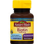 Nature Made Biotin 2500 mcg extra strength softgels in orange bottle, dietary supplement for healthy hair and skin.