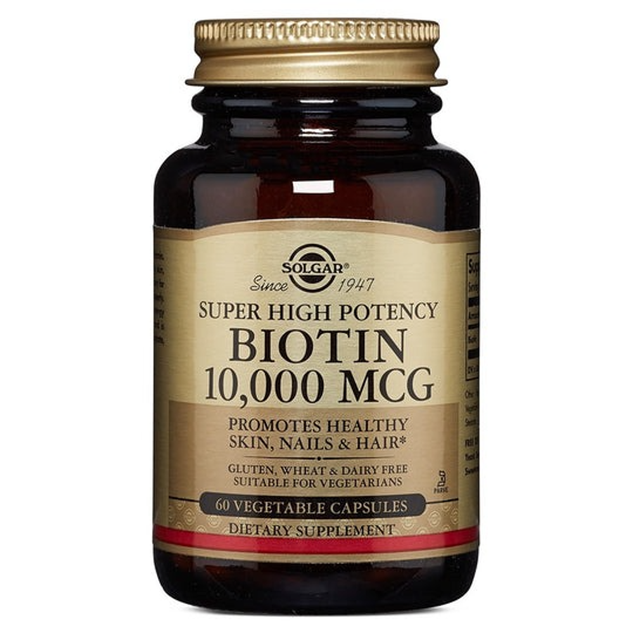 Solgar Super High Potency Biotin 10,000 mcg supplement in 60 vegetable capsules, stored in a clear bottle with a label.