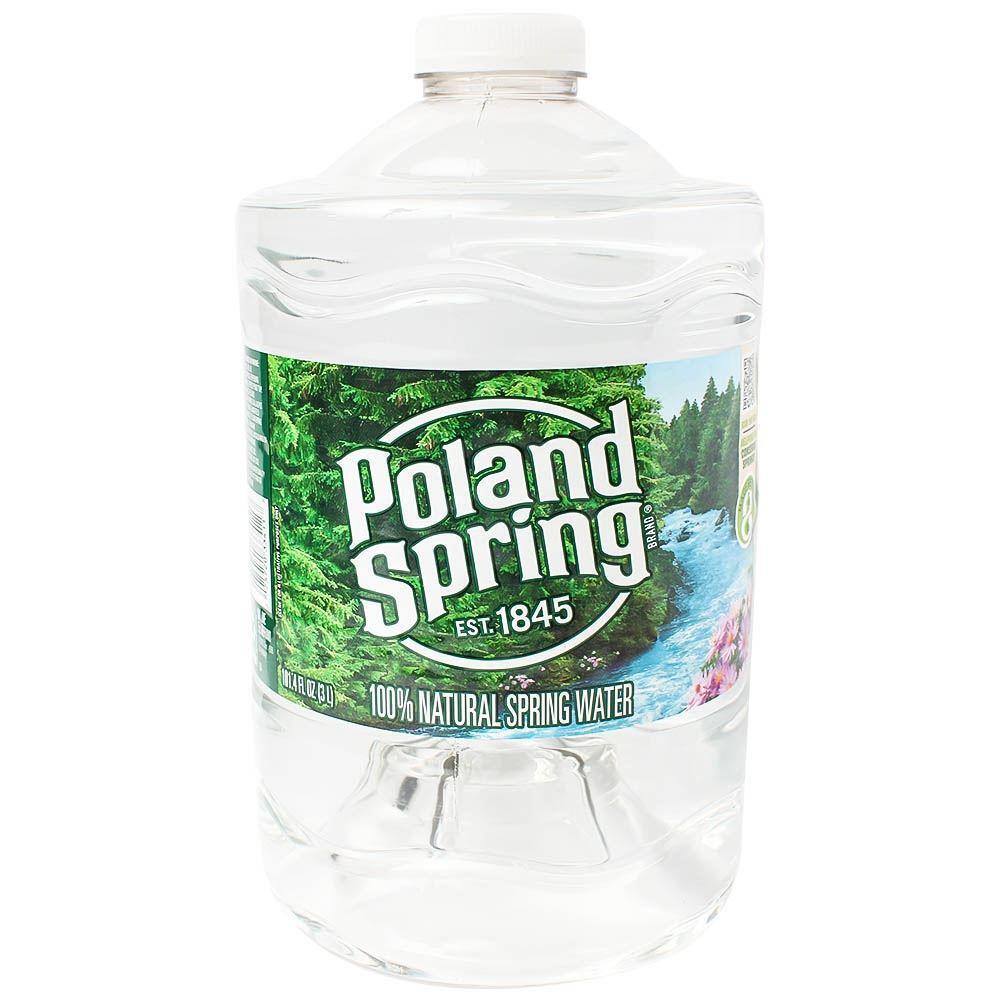 Poland Spring natural bottled water in a 101.4 fl oz jug, featuring clear water and labeling from Pasteur Pharmacy.