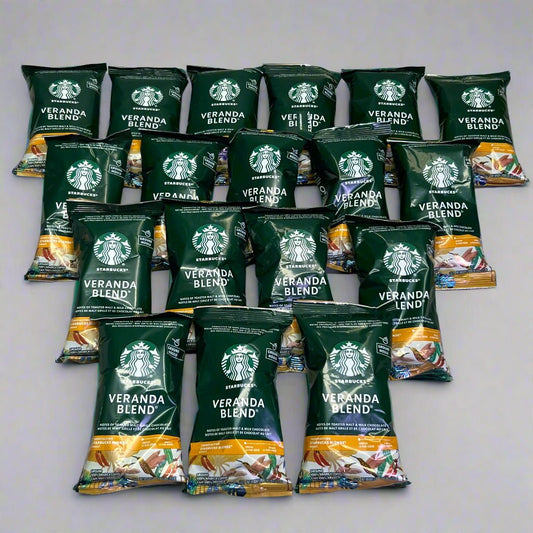 Starbucks Veranda Blend ground coffee 18-pack, blonde roast, 2.5 oz bags, green packaging, natural and smooth flavor.