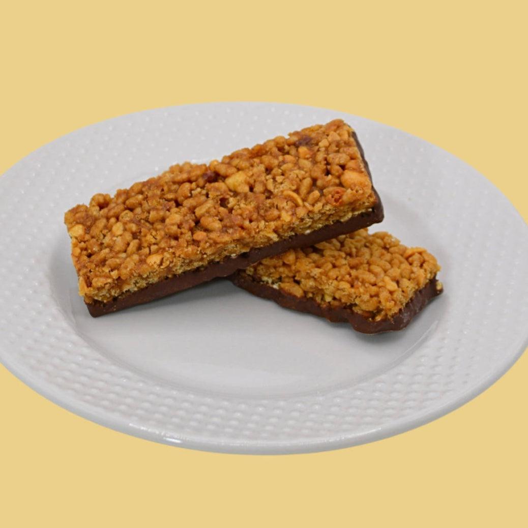 AmBari Nutrition Peanut Crisp Bar showing a crunchy peanut-filled snack bar on a white background