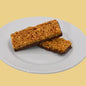 AmBari Nutrition Peanut Crisp Bar showing a crunchy peanut-filled snack bar on a white background