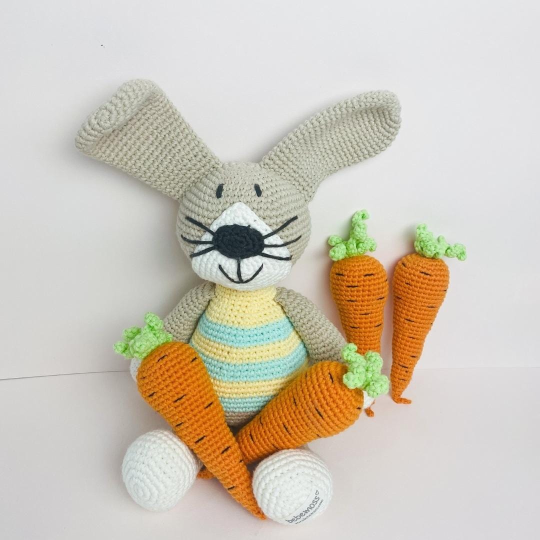 Green handmade stuffed rabbit named Pip by Bebemoss, made from organic cotton, soft and cuddly for children.