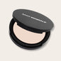 Close-up of SAINT MINERALS Pressed Powder Foundation in warm shade, showing smooth, pressed powder with a natural finish.