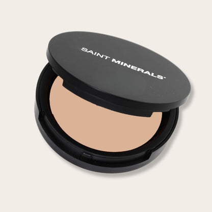 Pressed powder foundation by Panoply Beauty in warm tones, showing the smoothly pressed product with a matte finish.