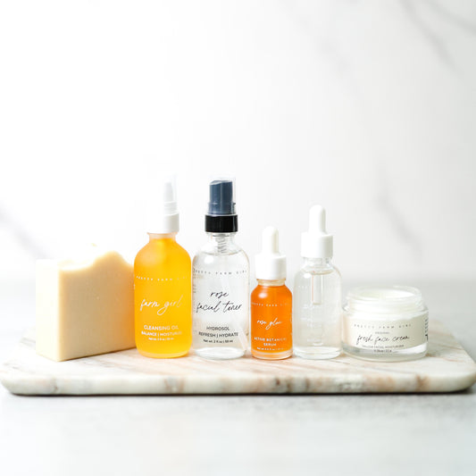 Pretty Farm Girl anti-aging skincare routine essentials kit bundle with creams, serums, and skincare products.