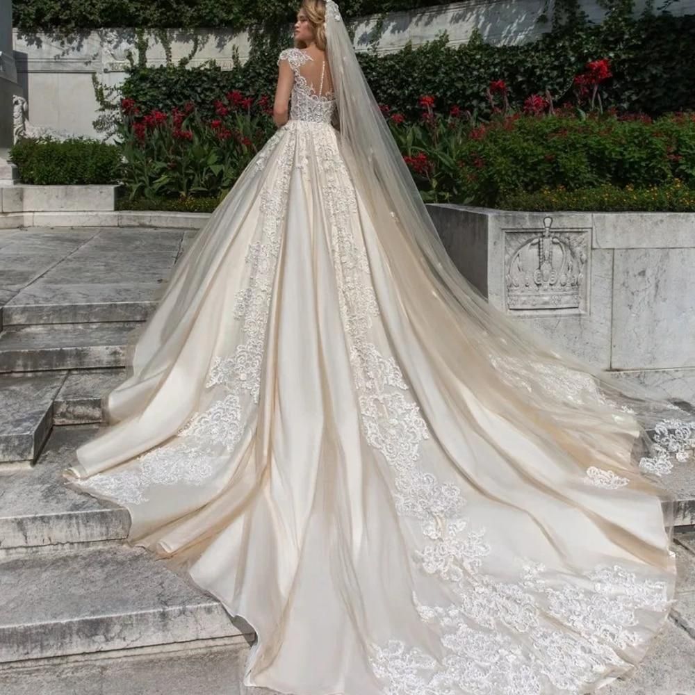 Vintage cap sleeve luxury ball gown wedding dress from EdleessFashion, featuring intricate details and elegant fabric.