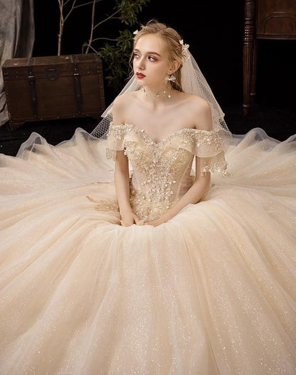 Shiny vintage off-shoulder wedding dress with crystal bead embellishments by EdleessFashion, luxurious gown for special occasions.
