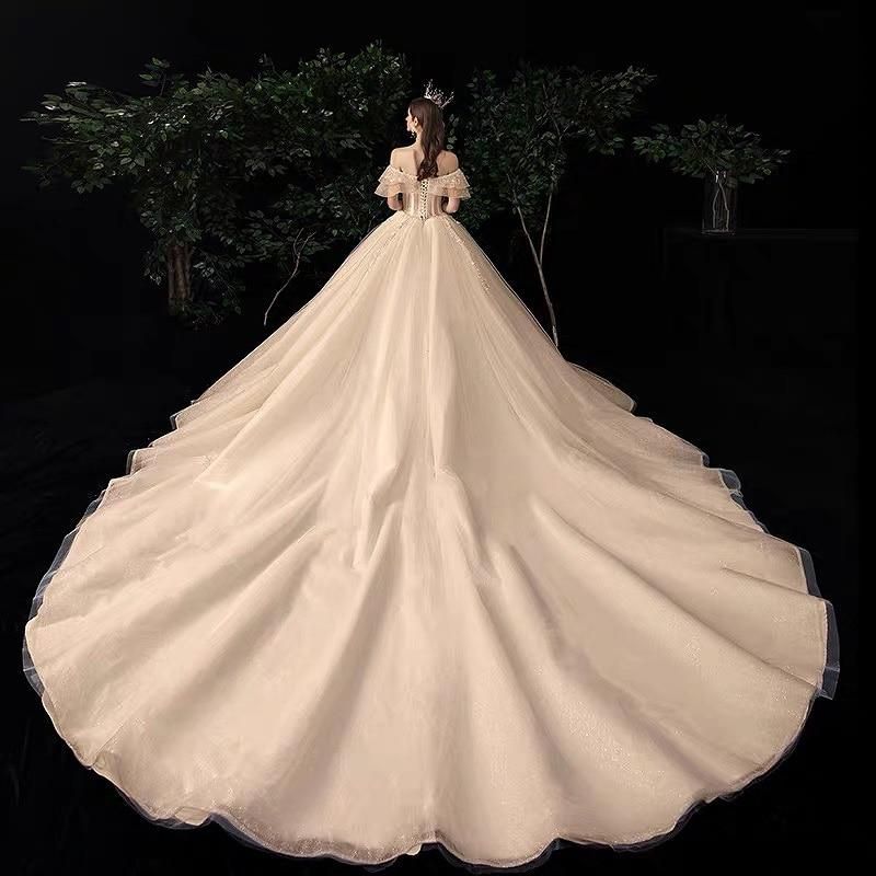 Shiny vintage off-shoulder wedding dress with crystal bead detailing, luxurious gown by EdleessFashion, elegant bridal attire