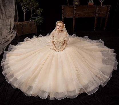 Shiny vintage off-shoulder wedding dress with crystal bead embellishments by EdleessFashion, luxurious bridal gown.