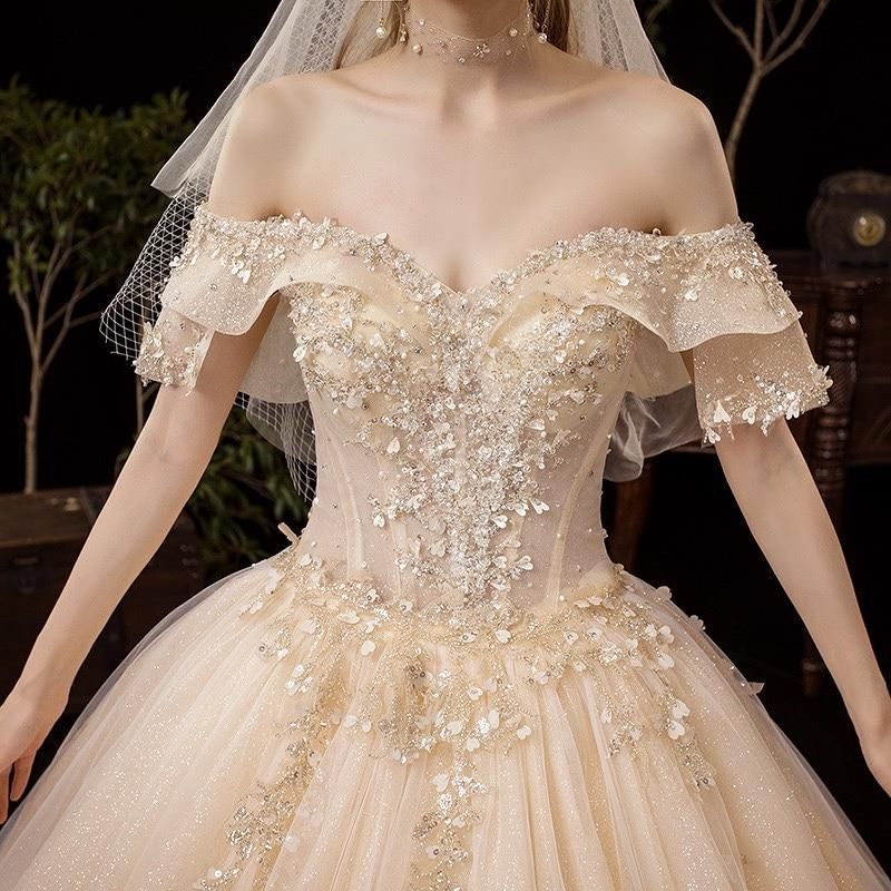 Shiny vintage off-shoulder wedding dress with crystal bead embellishments, luxurious gown by EdleessFashion.