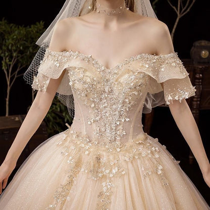 Shiny vintage off-shoulder wedding dress with crystal bead embellishments, luxurious gown by EdleessFashion.