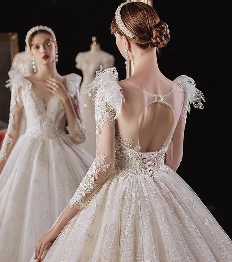 Elegant princess wedding dress with shiny pearls by EdleessFashion, featuring intricate details and flowing fabric for a luxurious look.
