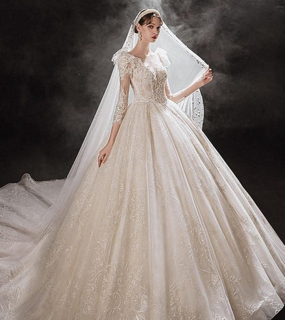 Elegant princess wedding dress by EdleessFashion with shiny pearls and flowing fabric, perfect for a fairytale bridal look.