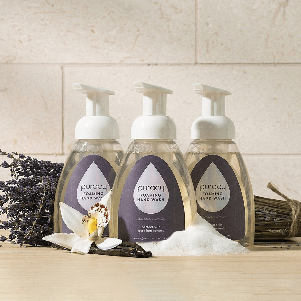 Puracy lavender vanilla foaming hand soap bottles in a pack of three, featuring pump dispensers and lavender vanilla scent.