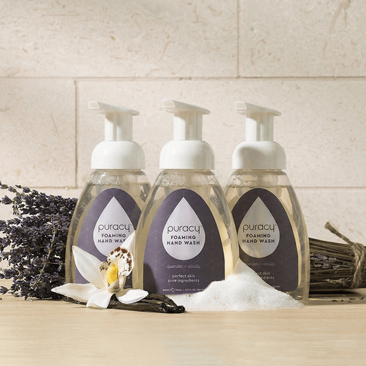 Puracy lavender vanilla foaming hand soap bottles in a pack of three, featuring pump dispensers and lavender vanilla scent.