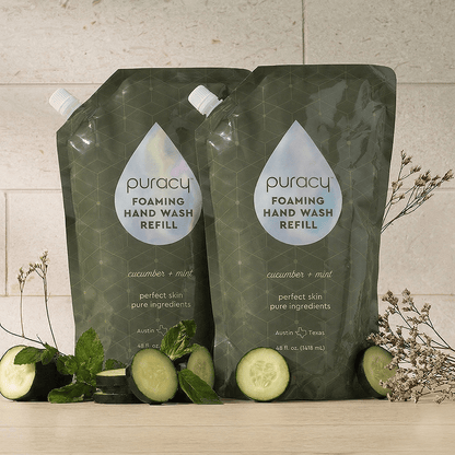 Set of three Puracy foaming hand soap bottles with lavender vanilla scent, featuring clean, minimalist pump bottles.