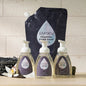 Set of three Puracy foaming hand soap bottles with lavender vanilla scent, featuring sleek pump dispensers and elegant labels.