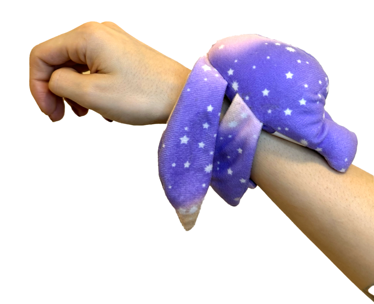 Purple plush wrist hugger from Moon Pals' Polli mini wrist hugger collection, featuring a soft, cuddly design.