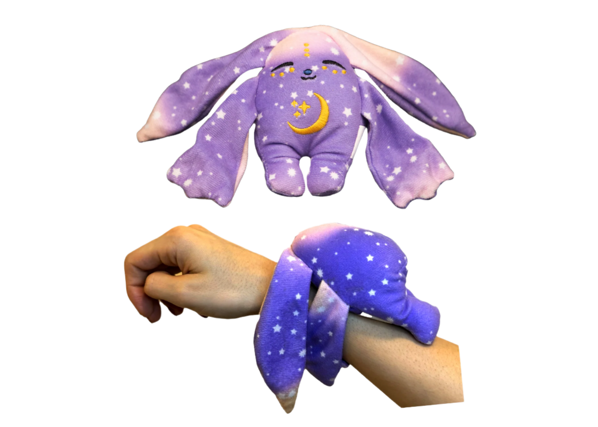 Purple Moon Pals Polli Mini Wrist Hugger Plush featuring a soft, cuddly design perfect for wrist comfort and playful style.