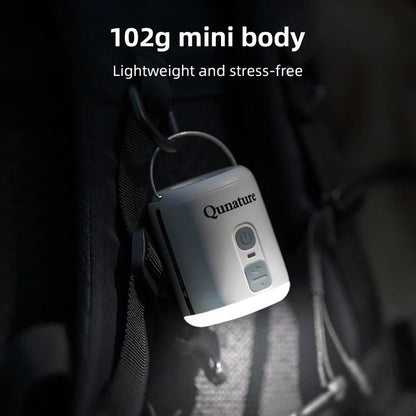 Qunature Global mini air pump with 4.5KPa pressure, 1600mAh battery, and built-in camping light in white.
