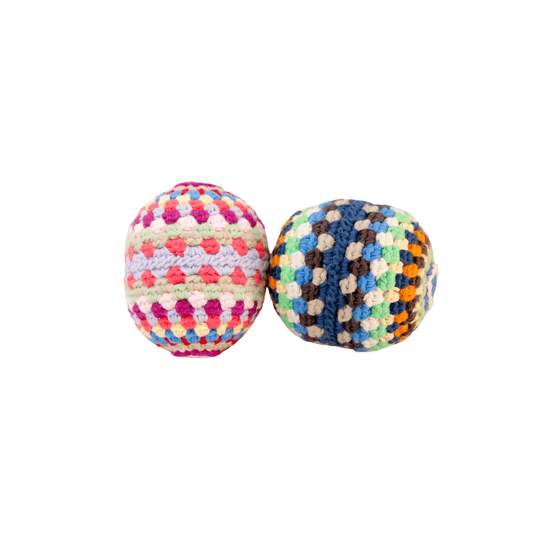 Colorful rainbow rattle ball toy made of handmade organic cotton, perfect for infants and sensory play.