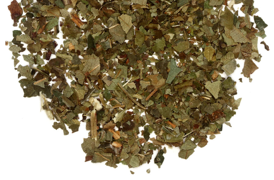 Loose leaf black raspberry leaves tea with spices, showcasing vibrant raspberry leaves and aromatic spices in a natural setting.