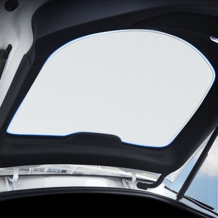 Rear liftgate sunshade for Tesla Model Y, black fabric cover reducing sunlight and glare in the vehicle's rear cargo area.