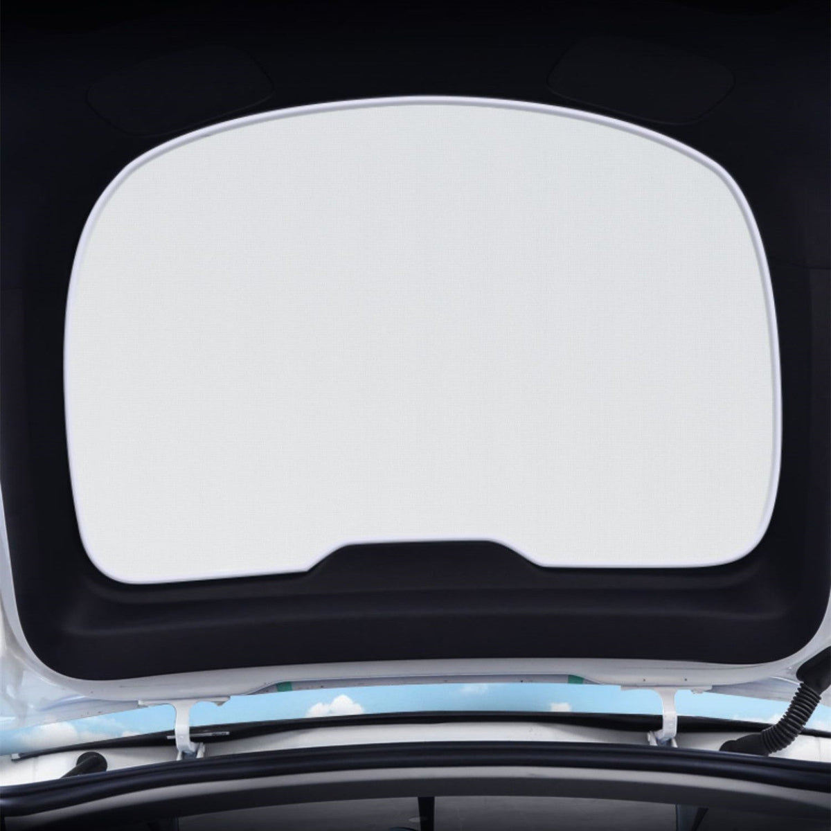 Tesla Model Y rear liftgate sunshade by Tesery Official Store, showing a dark tinted sunshade installed in the vehicle's rear liftgate area.