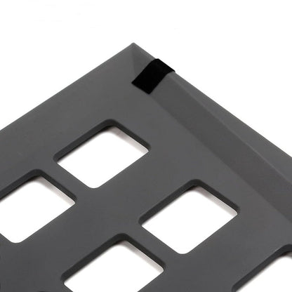 Pair of Tesla Cybertruck rear trunk lower grille baffles, black plastic covers, designed for truck airflow and protection.