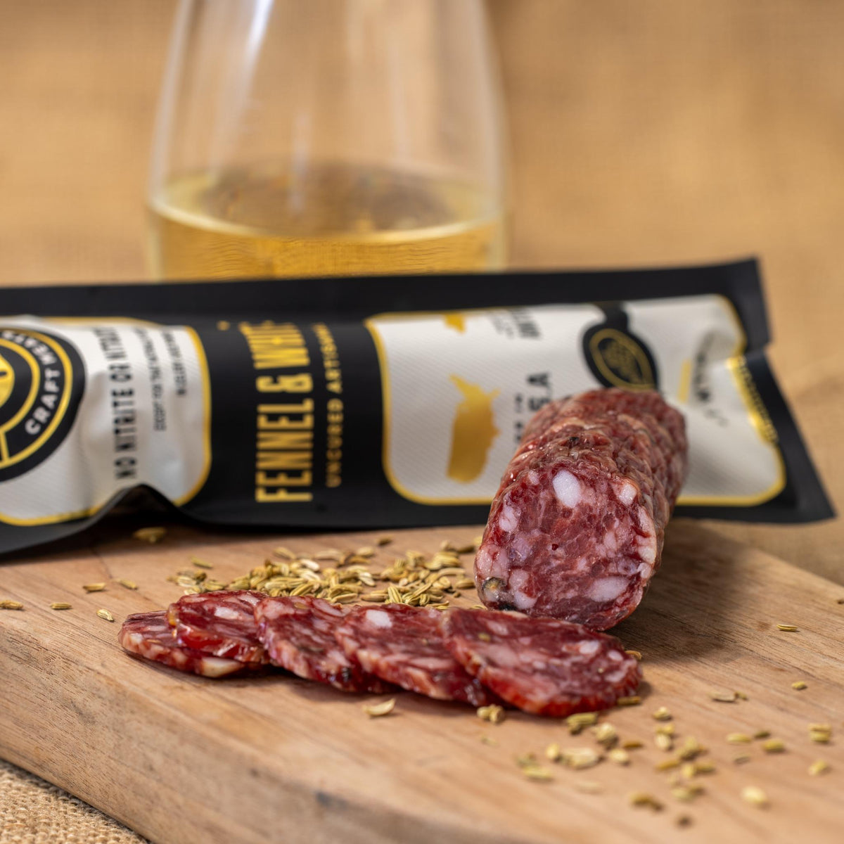 Slices of fennel and white wine in a dish, showcasing Gastros Craft Meats' fennel and white wine flavor blend.