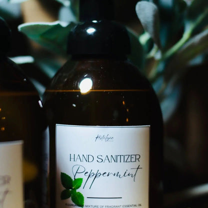Restalgic Atelier organic foaming hand sanitizer in 16oz bottle with orange, peppermint, and bergamot scent, showcasing the product label.