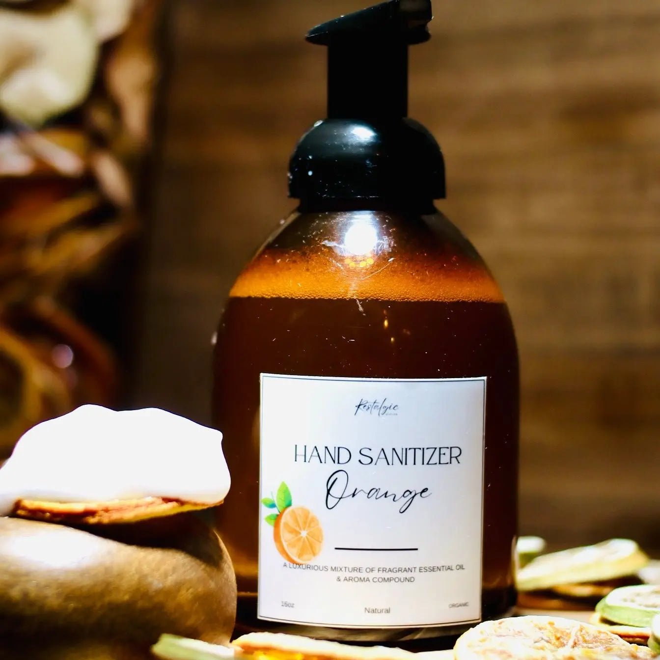 Restalgic Atelier organic foaming hand sanitizer 16oz with orange, peppermint, and bergamot essential oils in a clear bottle