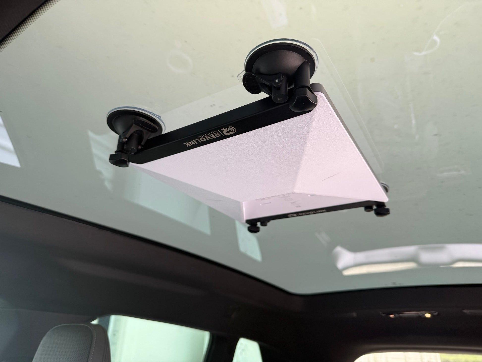 Black Starlink Mini Sunroof Mount by Revolink Satellite Gear securely attaches to vehicle sunroof for satellite internet setup.