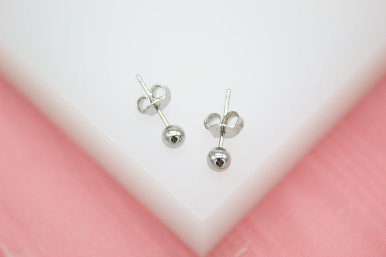 Rhodium-plated 18K gold filled tiny ball stud earrings by MIA Jewelry, small size, perfect for everyday wear.