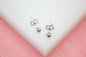 Rhodium-plated 18K gold filled tiny ball stud earrings by MIA Jewelry, small size, perfect for everyday wear.