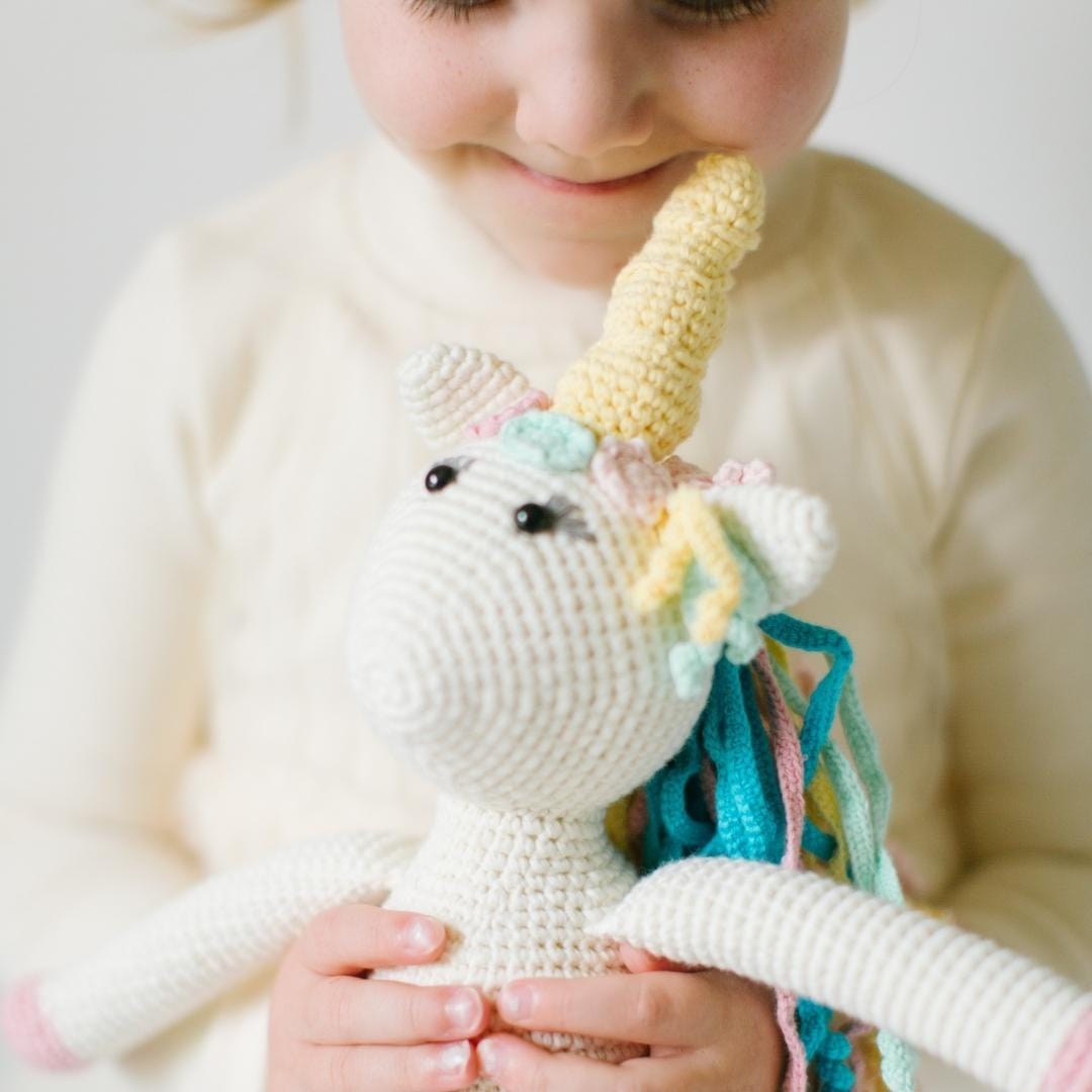 Handmade Rose the Unicorn stuffed animal made of organic cotton, soft plush toy, adorable and eco-friendly for children.