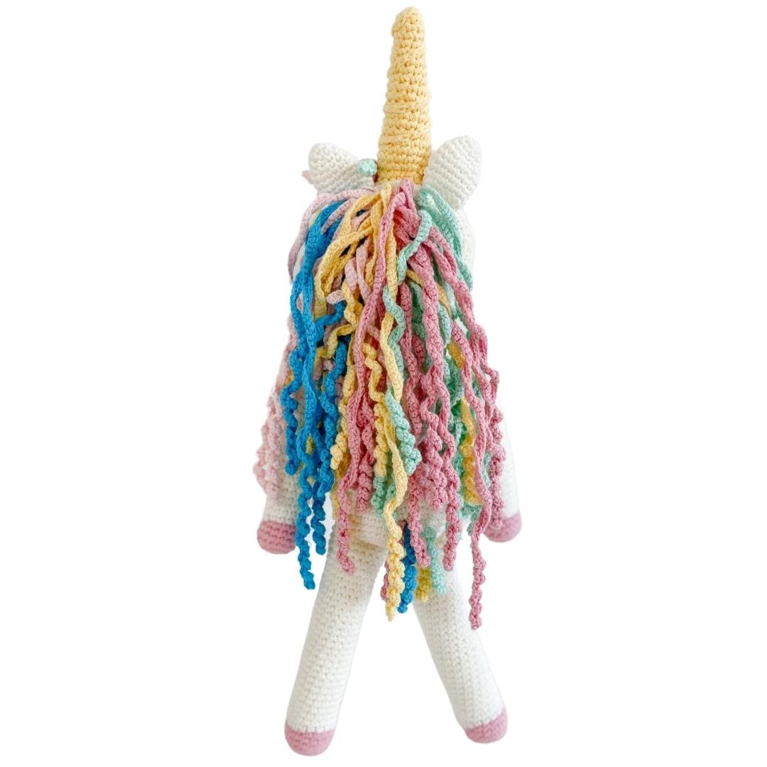 Handmade organic cotton unicorn stuffed animal named Rose by Bebemoss, featuring soft pastel colors and a cute design.