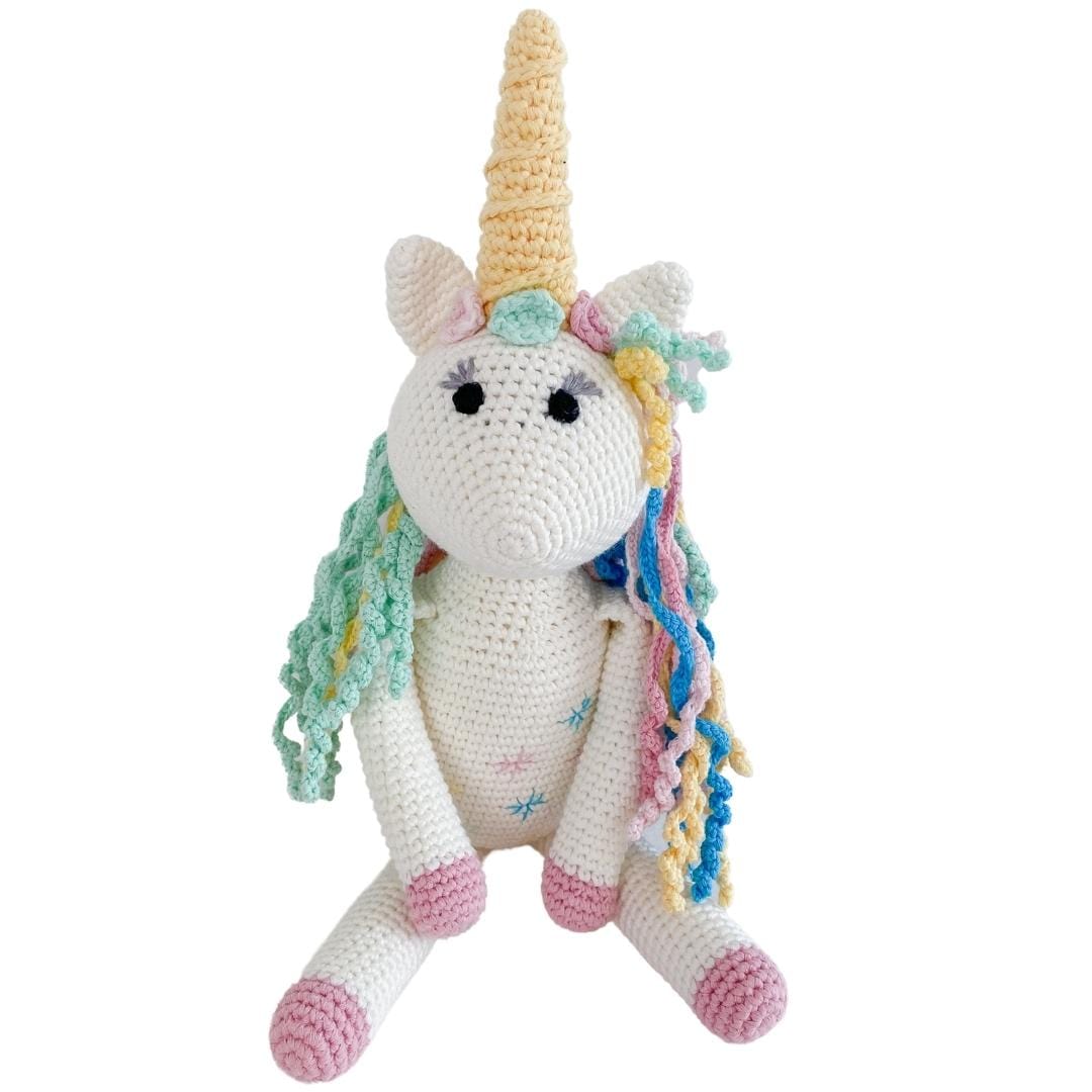 Handmade organic cotton stuffed unicorn named Rose by Bebemoss, featuring soft pastel colors and adorable details.