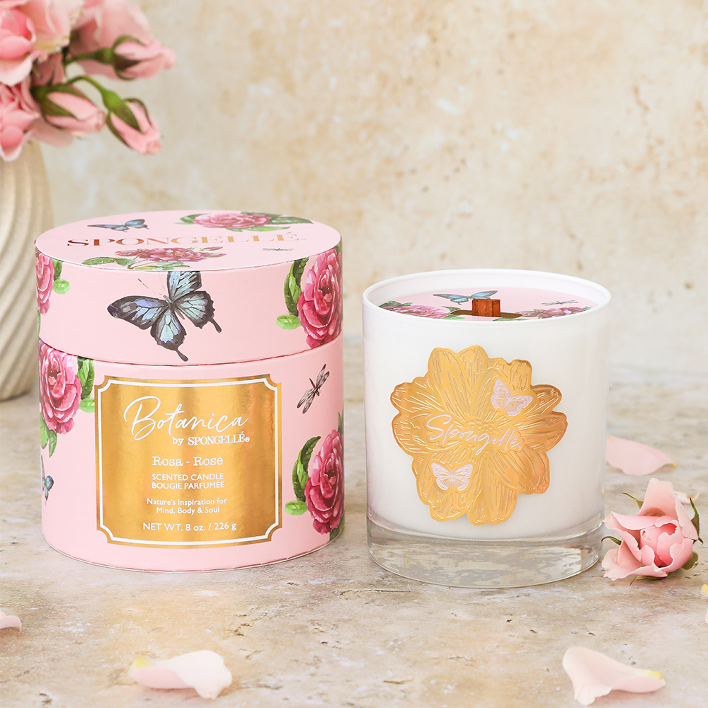 Botanica Rose candle by Spongellé, a home fragrance with a scented rose design in a glass jar.