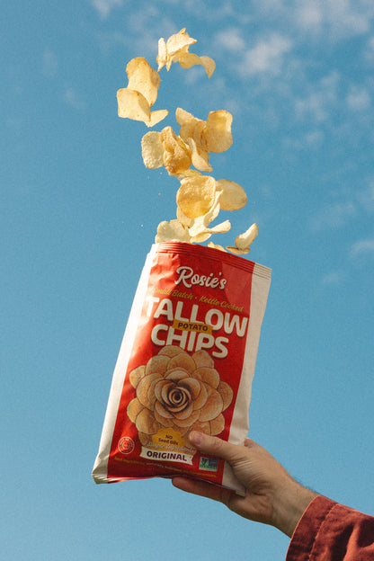 Golden, crispy potato chips from Rosie's Chips in a bowl, showcasing their crunchy texture and classic snack appeal.