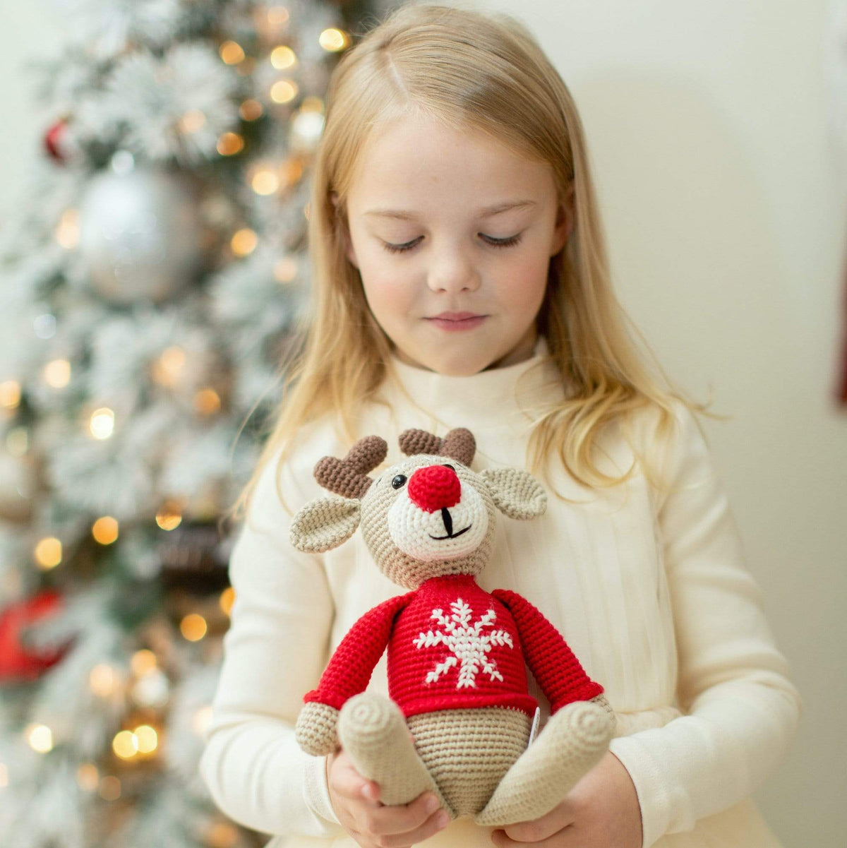 Handmade organic cotton stuffed reindeer toy named Ruddy by Bebemoss, featuring soft fabric and detailed embroidered features.