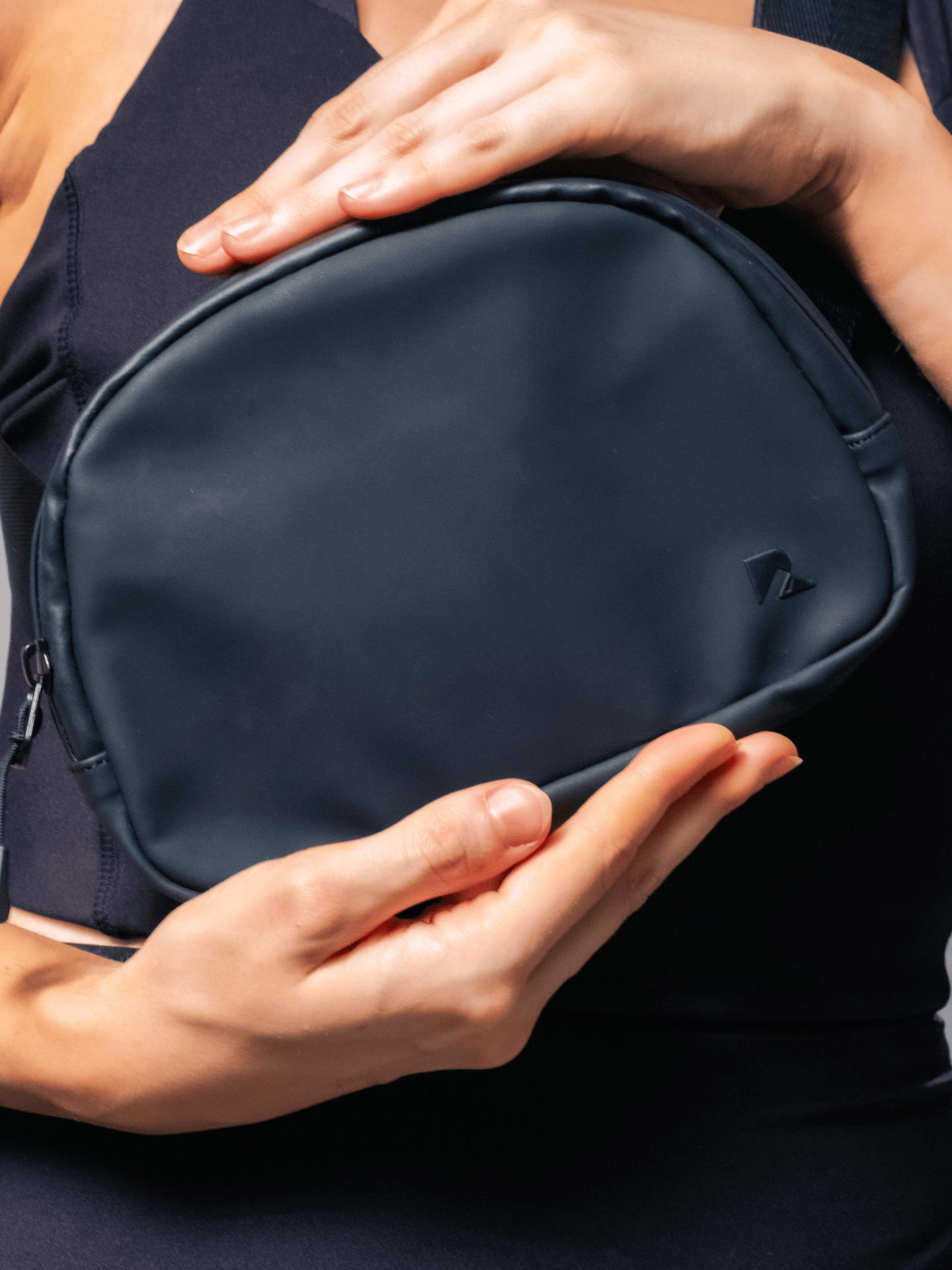 Black LuxeGo Small Crossbody Sling Bag by Runner's Athletics with adjustable strap and minimalist design.