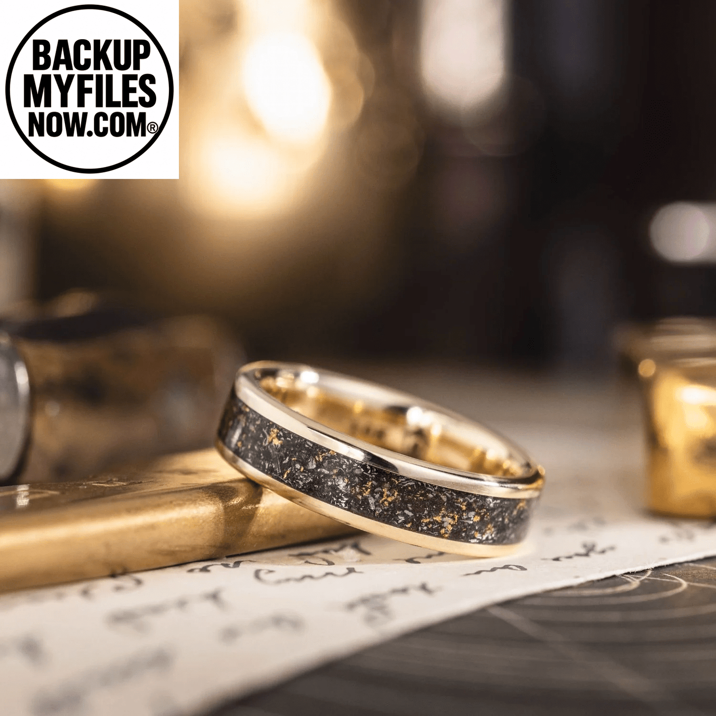 Men's gold wedding band with meteorite and gold flakes, featuring a 3mm 10K yellow gold band and rustic finish.