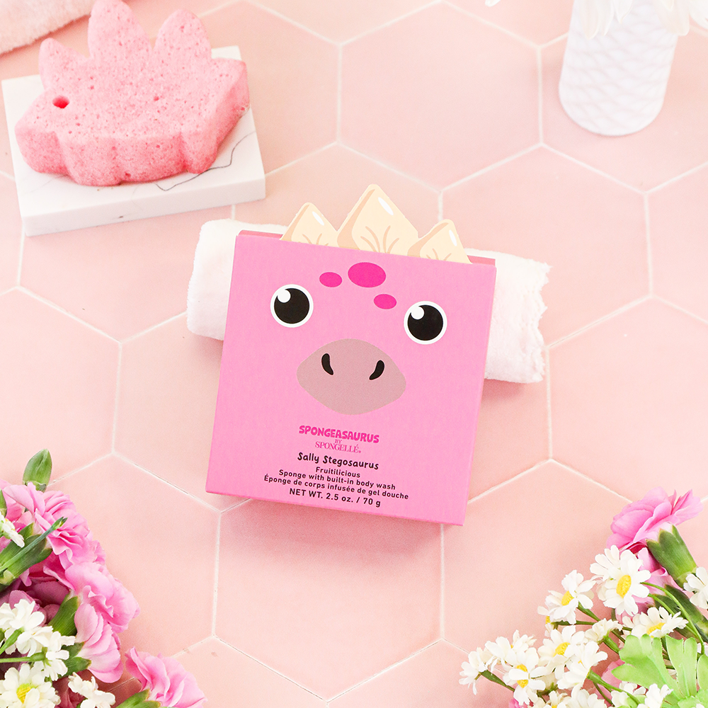 Sally Stegosaurus Spongeasaurus dinosaur body wash infused buffer with colorful stegosaurus design and textured surface for exfoliation.