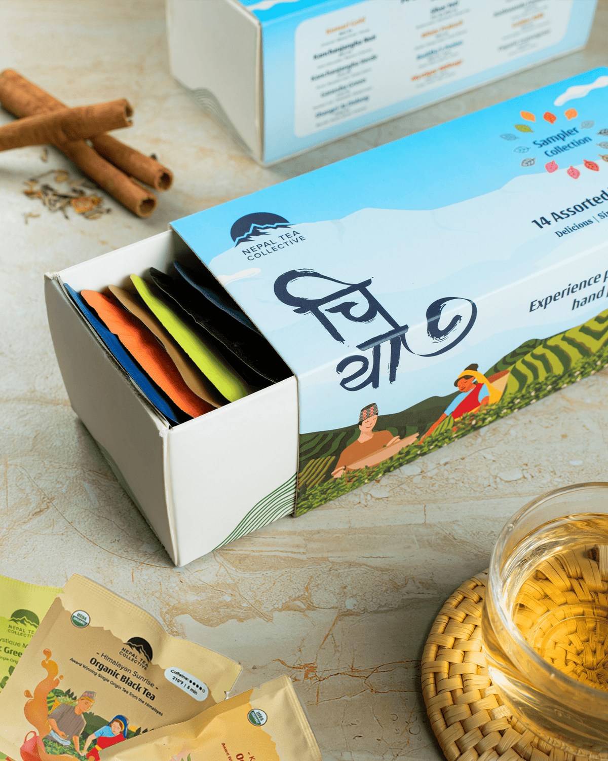 Assorted organic Nepal Tea sampler bundle featuring various tea leaves in a decorative box, showcasing the Nepal Tea brand.