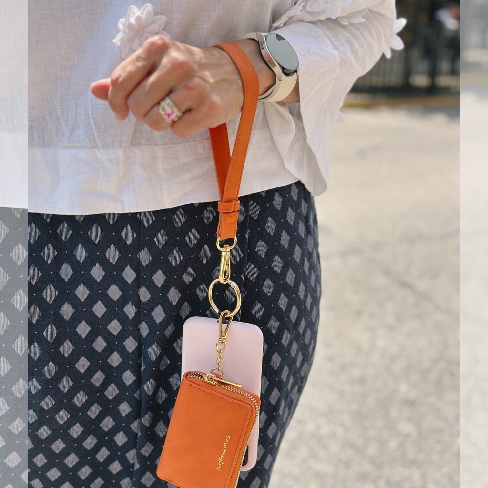 SaveTheGirls Clip & Go Strap with pouch in brushed vegan leather, deep cream rose color, gold hardware, and clip attachment.