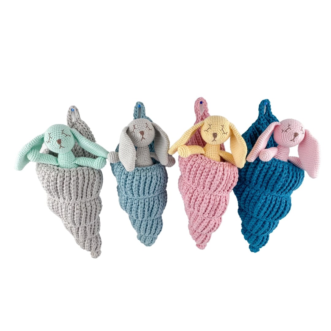Handmade sea shell basket stuffed animal toy made from organic cotton by Bebemoss, designed for children.